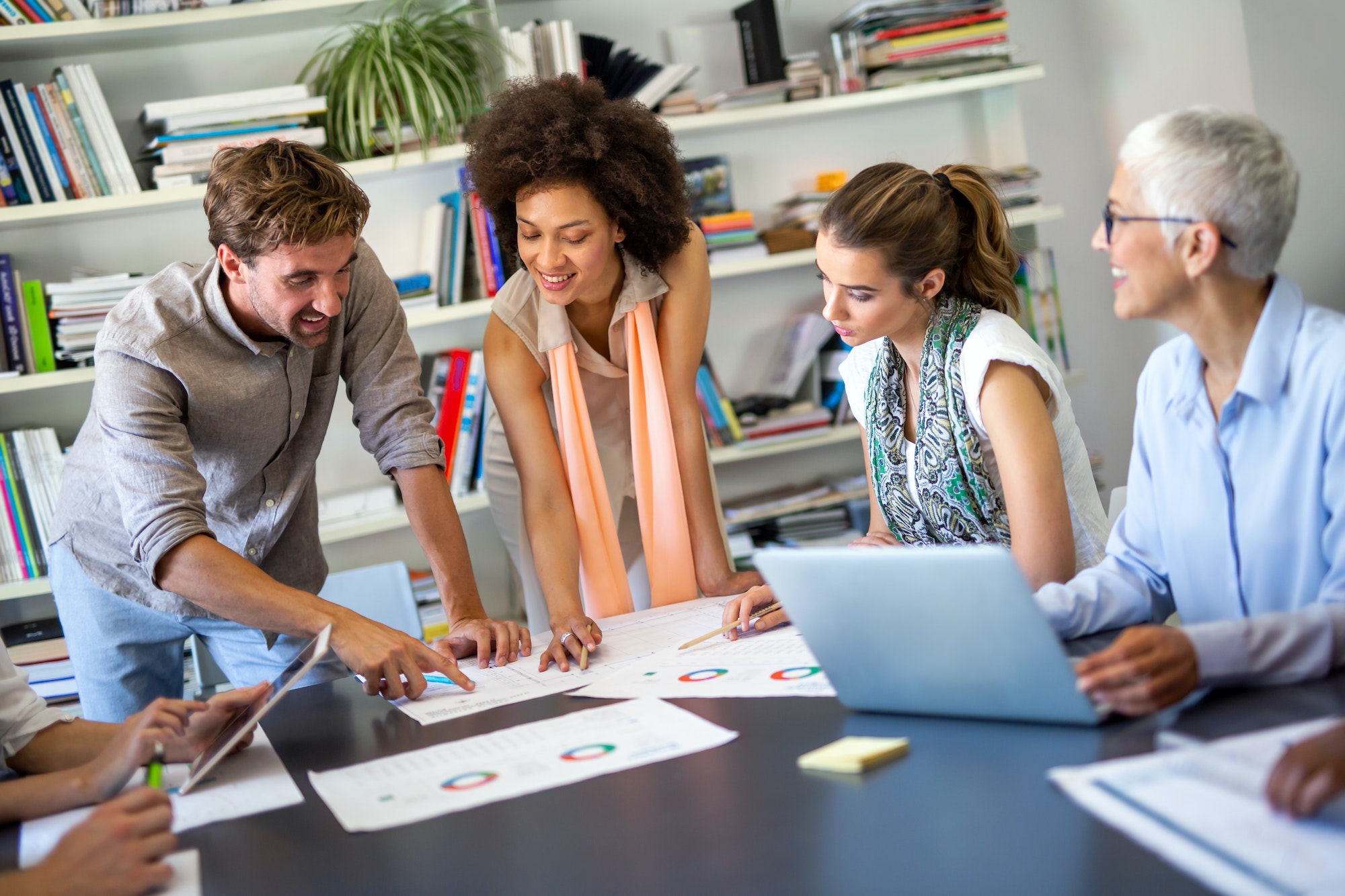 Group of happy multiethnic success business people working and brainstorming in corporate office